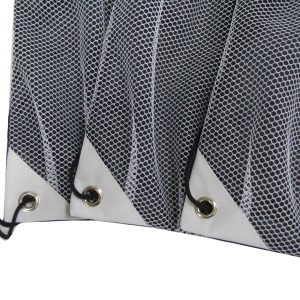 Close-up of metal grommet and white reinforced corner on black cinch bag