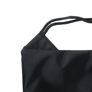 Close-up of black drawstring backpack top opening and rope detail