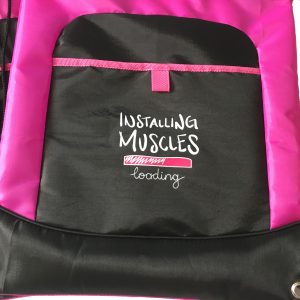 Close-up of funny gym slogan print on black pouch