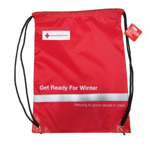 Red winter safety drawstring bag with custom NGO logo and hang tag