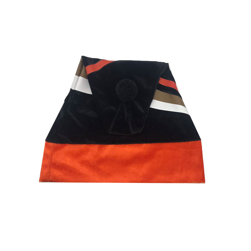 Folded color-block Santa hat showing the attached black pom-pom