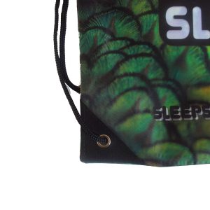 Close-up of black reinforced corner patch and metal grommet on sublimation bag
