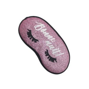 Angled view of pink glitter sleep mask with black edge binding
