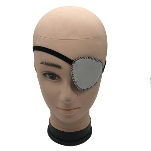 Grey eco-friendly single eye patch with zigzag stitching on model