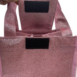 Close-up of black Velcro closure flap on maroon glitter lunch bag