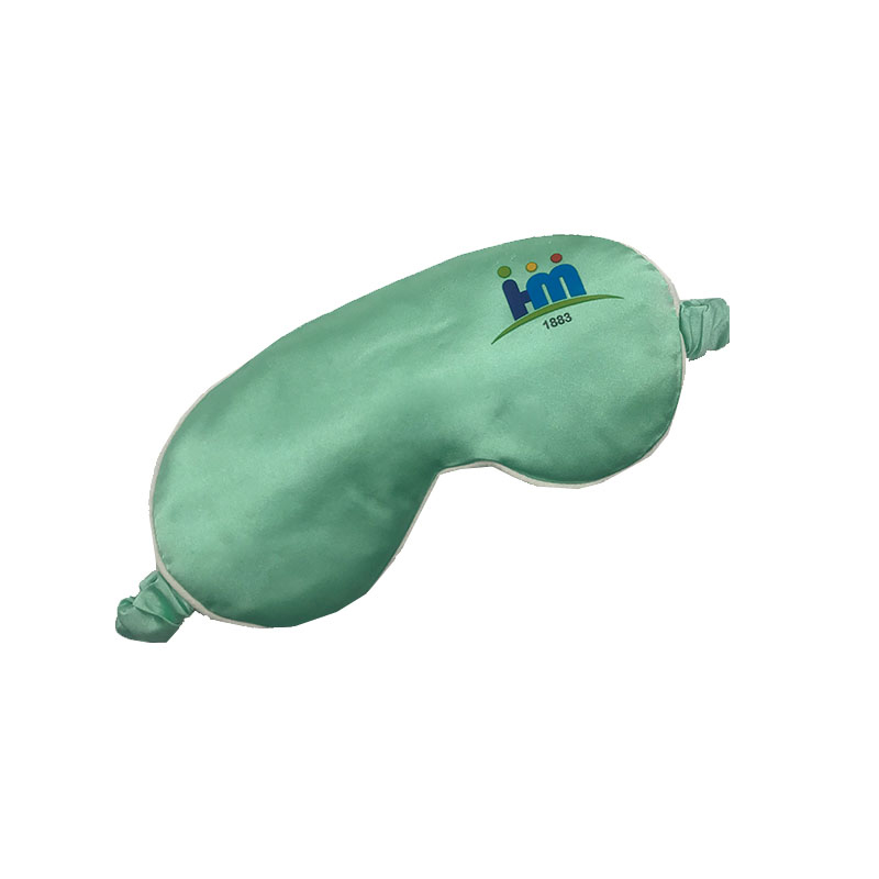 Mint green sleep mask angled view with printed logo