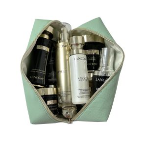 Large mint green makeup bag filled with skincare bottles showing capacity and inner lining