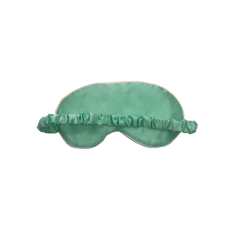 Back view of mint green sleep mask showing ruched elastic strap