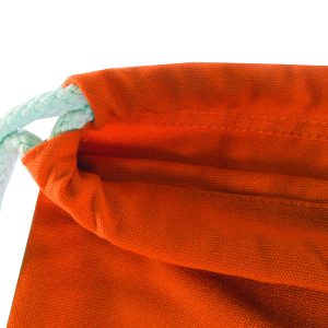 Close-up of thick braided cotton cord and cinch top on orange canvas bag