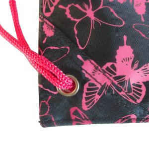 Close-up of pink braided rope and metal grommet on butterfly bag