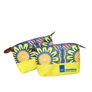 Two aboriginal art pattern zipper pouches with yellow bases and brown leather pulls