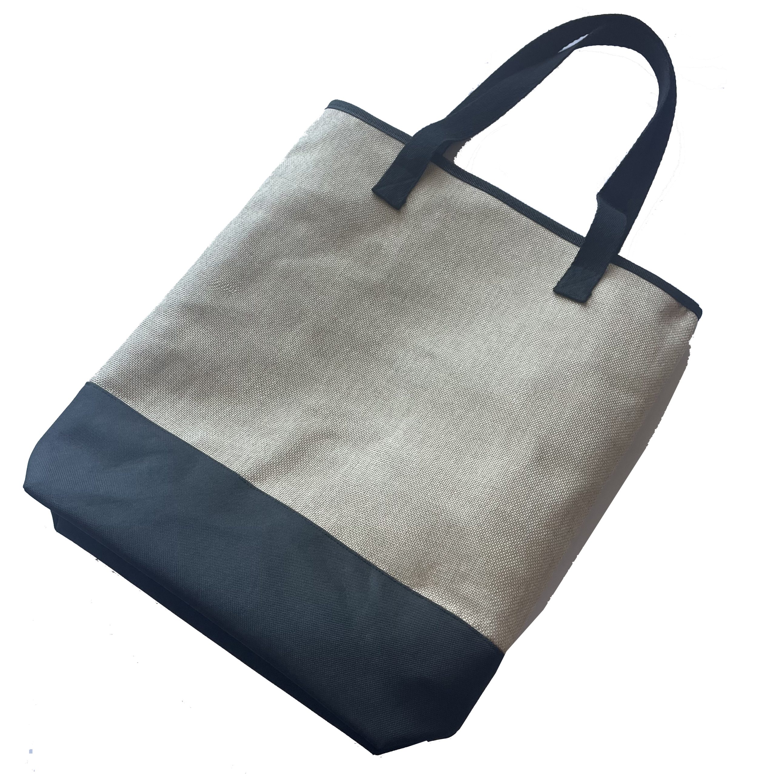 Angled view of beige woven tote bag with black top piping and black handles