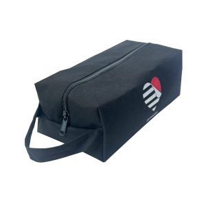 Black cosmetic bag angled side view showing sturdy side handle and metal zipper pull
