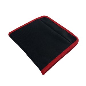 Folded black and red canvas tool roll pouch with edge binding closed view