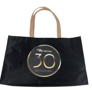 Black tote bag back view with gold BOTOX 30th Anniversary circular logo
