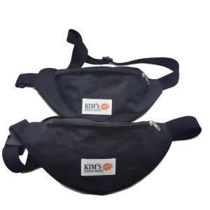 Two black waist bags stacked showing top zipper and adjustable buckle