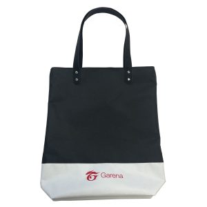 Black and white spliced tote bag front view with Garena logo