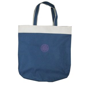 Blue canvas tote bag with white trim and woven handles front view