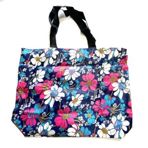 Back view of navy blue floral printed foldable tote bag