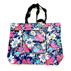 Blue floral zippered shopping tote bag front view with black woven straps