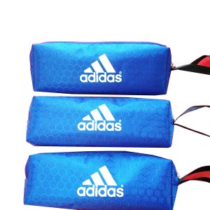 Stack of three blue hexagonal oxford zipper pouches with heat transfer logo