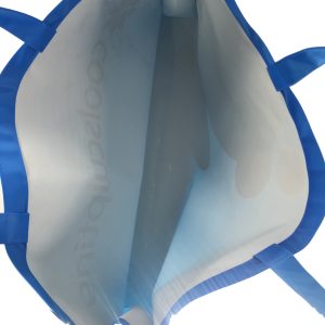 Interior view of blue branded tote bag showing clean lining and handle attachment
