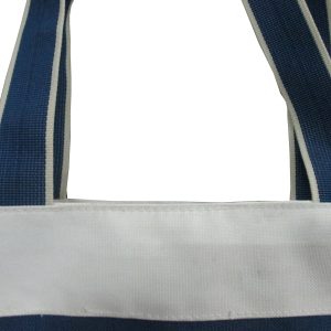 Blue and white striped woven handle detail on canvas tote bag