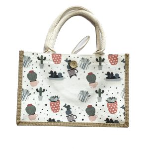 Canvas tote bag with cactus pattern, jute edge binding, and wooden button closure