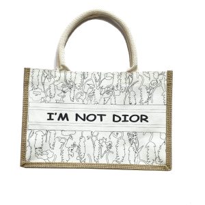 Black and white botanical sketch tote bag with I'M NOT DIOR slogan and wooden button