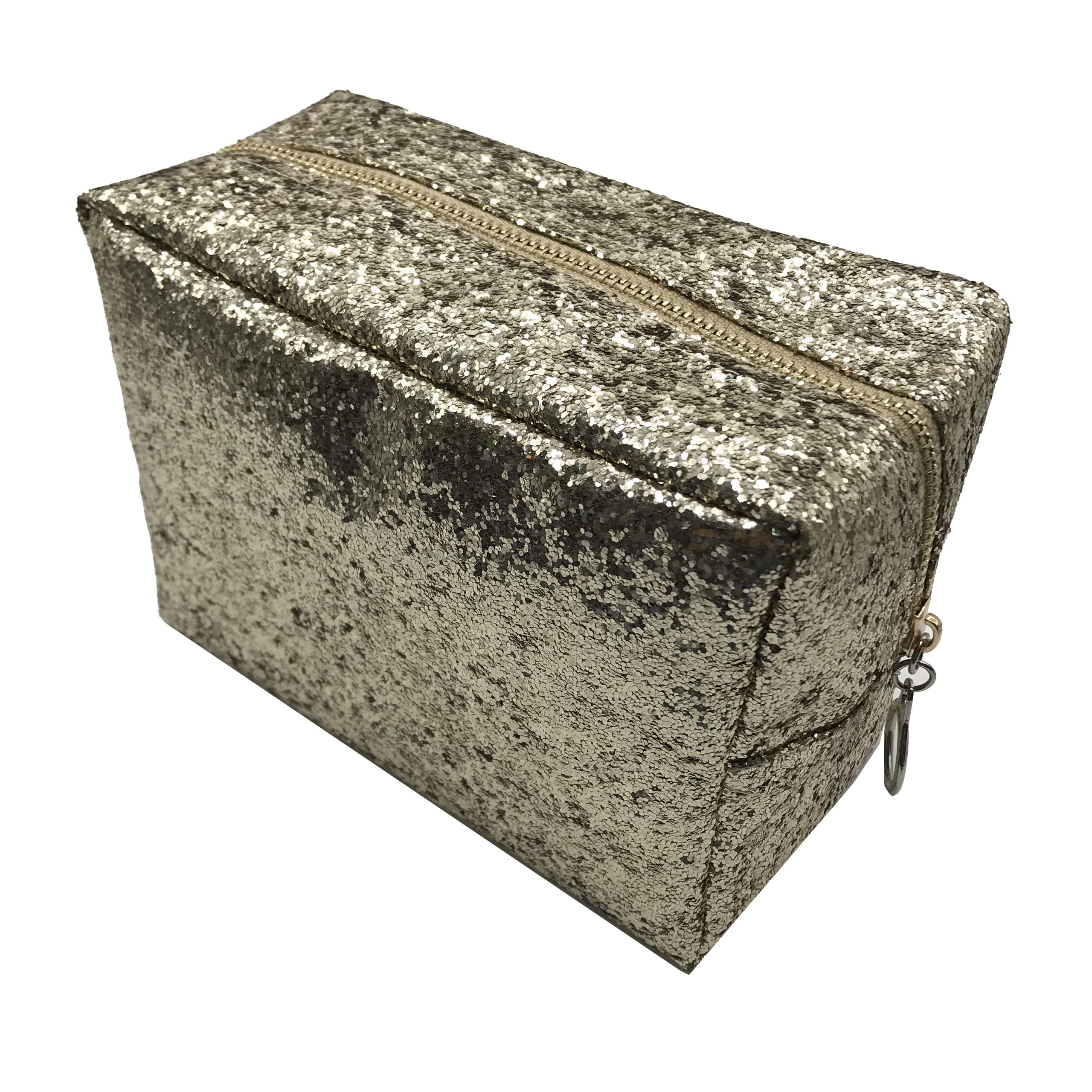 Champagne silver glitter makeup bag angled view with metal ring zipper pull