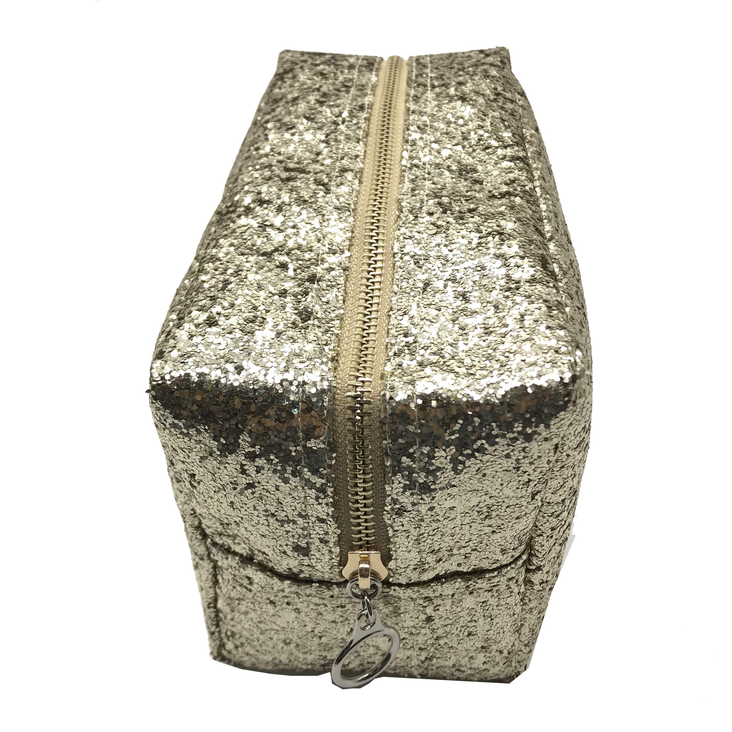 Champagne glitter cosmetic pouch front view showing metal zipper and ring pull