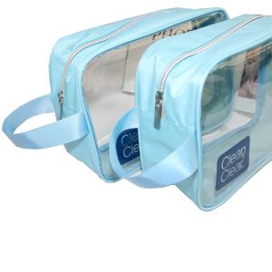 Stacked clear PVC toiletry bags with blue fabric trim and side handles