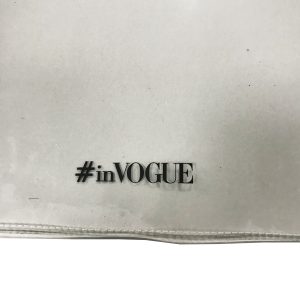 Close-up of #inVOGUE black screen print on clear TPU bag