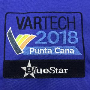 Detailed view of custom embroidered VARTECH 2018 Punta Cana patch with BlueStar logo