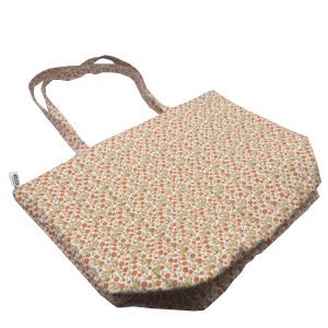 Angled view of floral canvas tote bag showing structured bottom and side