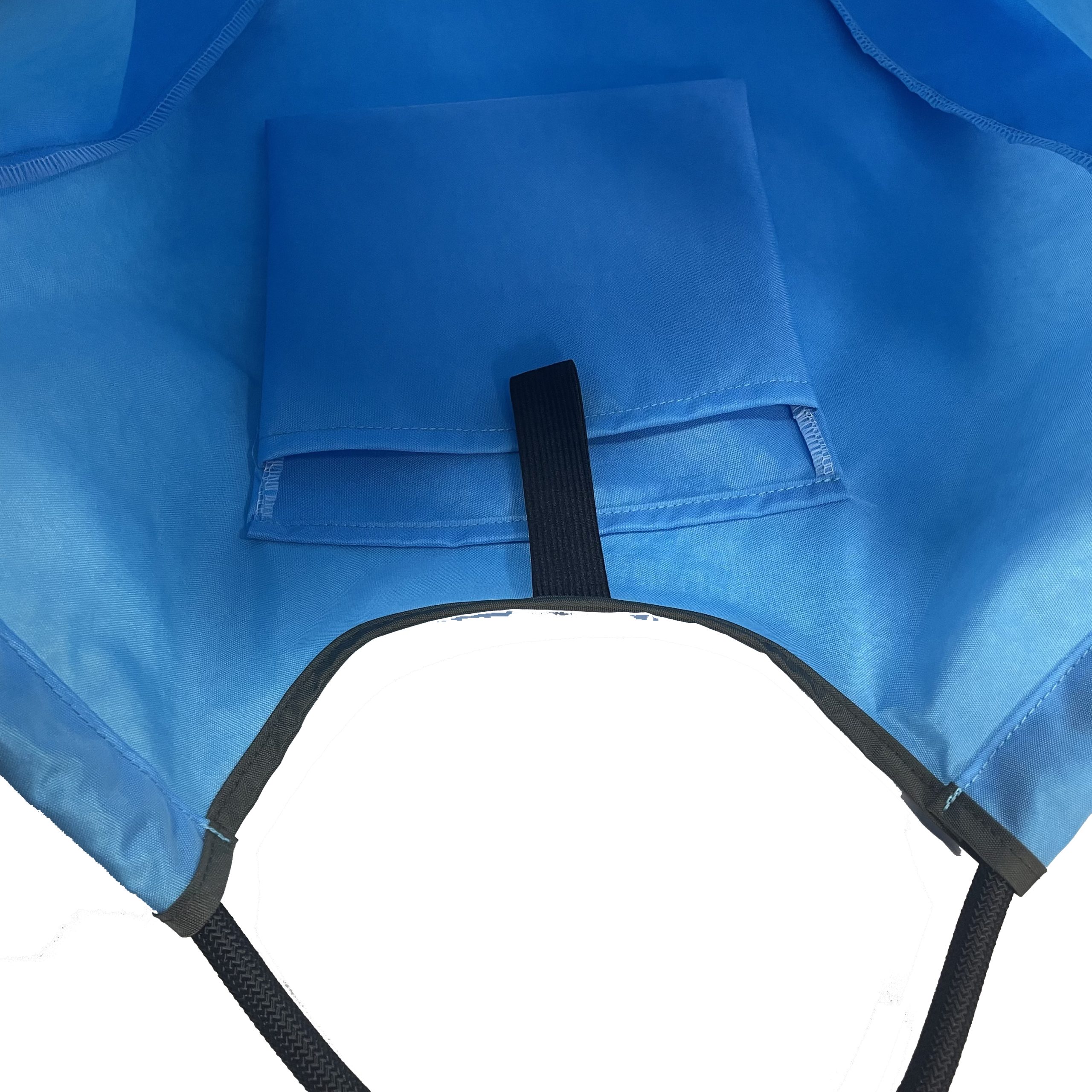 Inner pocket detail of blue foldable tote bag with black edge binding