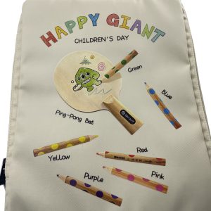 Close-up of colorful crayon and ping-pong bat print on children's gift bag