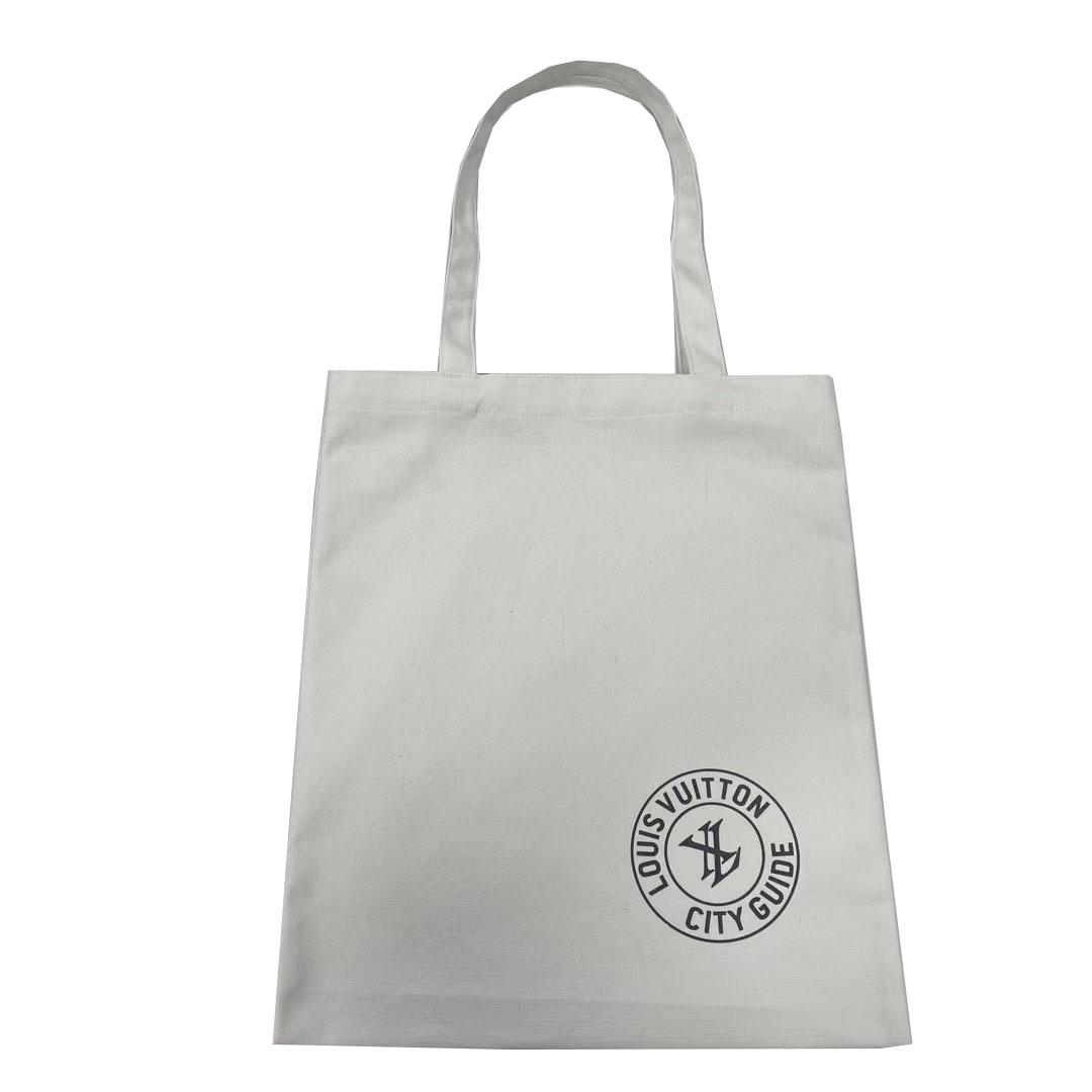 Light grey canvas tote bag with black circular logo print and thin handles
