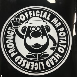 Detailed view of circular brand logo silk-screen printed on black TPU bag