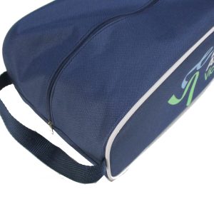 Side view of navy shoe bag showing top zipper and woven handle