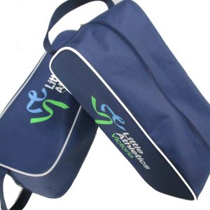 Stack of navy athletic shoe bags with white piping and custom logos
