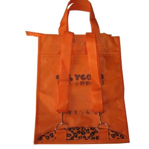 Orange tote bag back view showing adjustable shoulder straps and metal rings