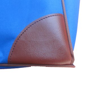 Brown PU reinforced corner patch detail on blue oxford tote bag