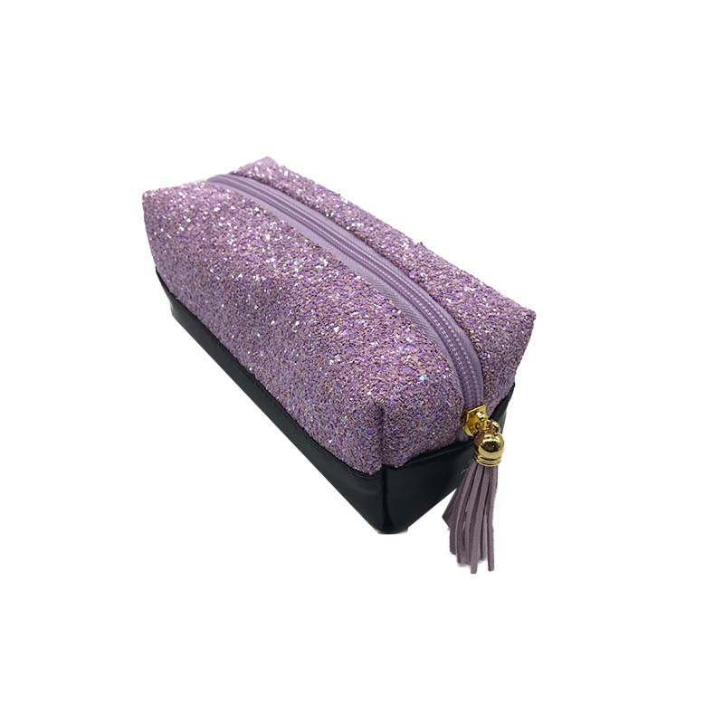 Purple glitter PU makeup pouch angled view with tassel zipper pull