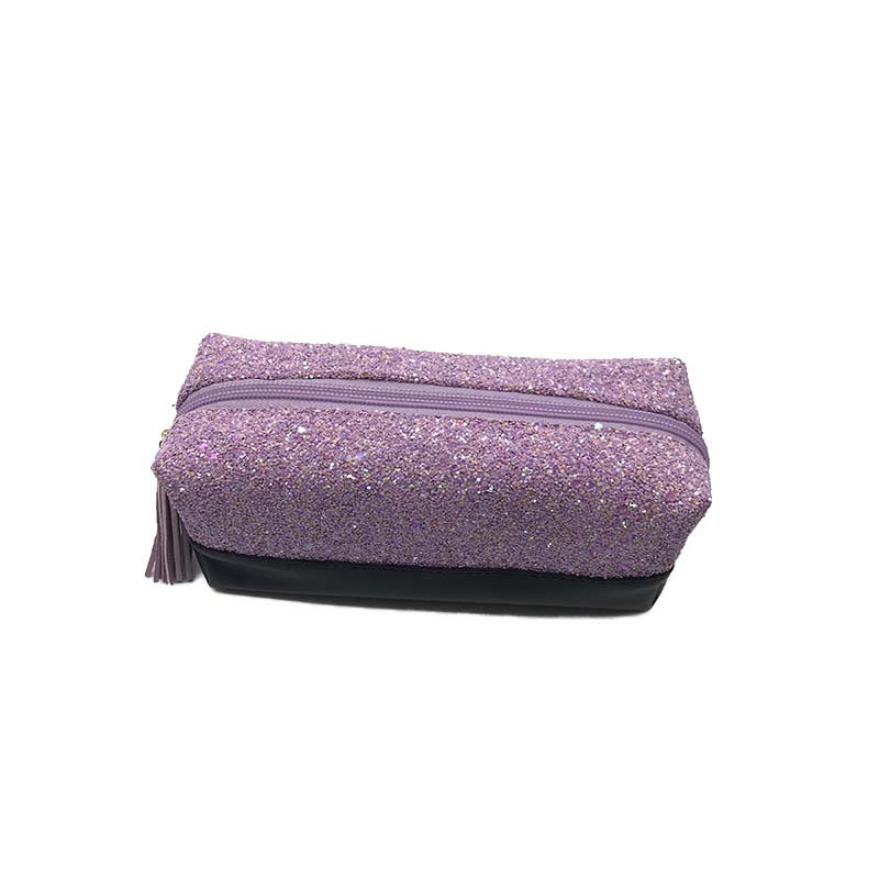 Purple glitter cosmetic bag with gold zipper and tassel detail