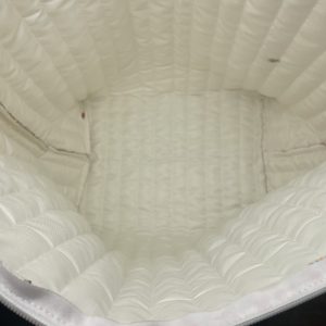 Thick white wave-patterned quilted interior lining of floral tote bag