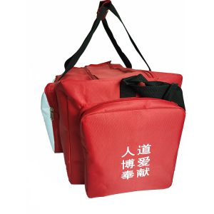 Red duffel bag side zipper pocket with white printed charity text