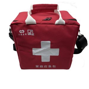 Red portable kit bag with white handles and double black zipper closure