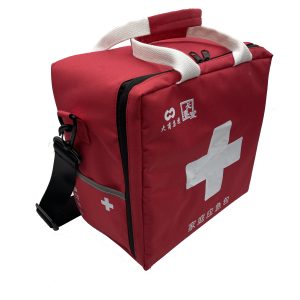 Red emergency storage bag angled view with adjustable black shoulder strap