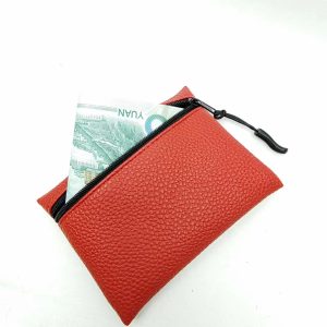 Red pebbled PU leather zipper pouch with black pull cord tab
